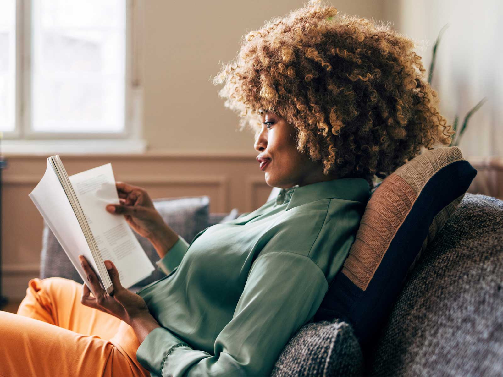 Woman reading a book about mental health