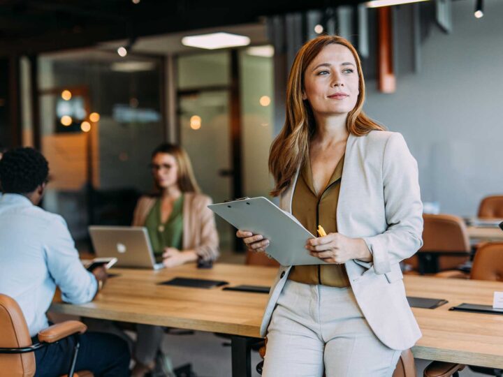 Female employee thinking about the signs of employee disengagement at her company.