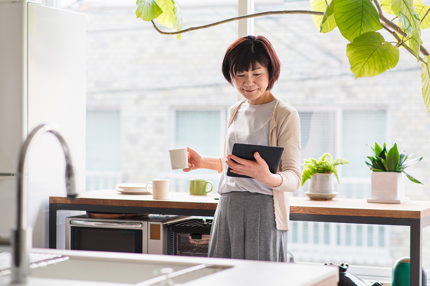 Woman looking at social media on her tablet