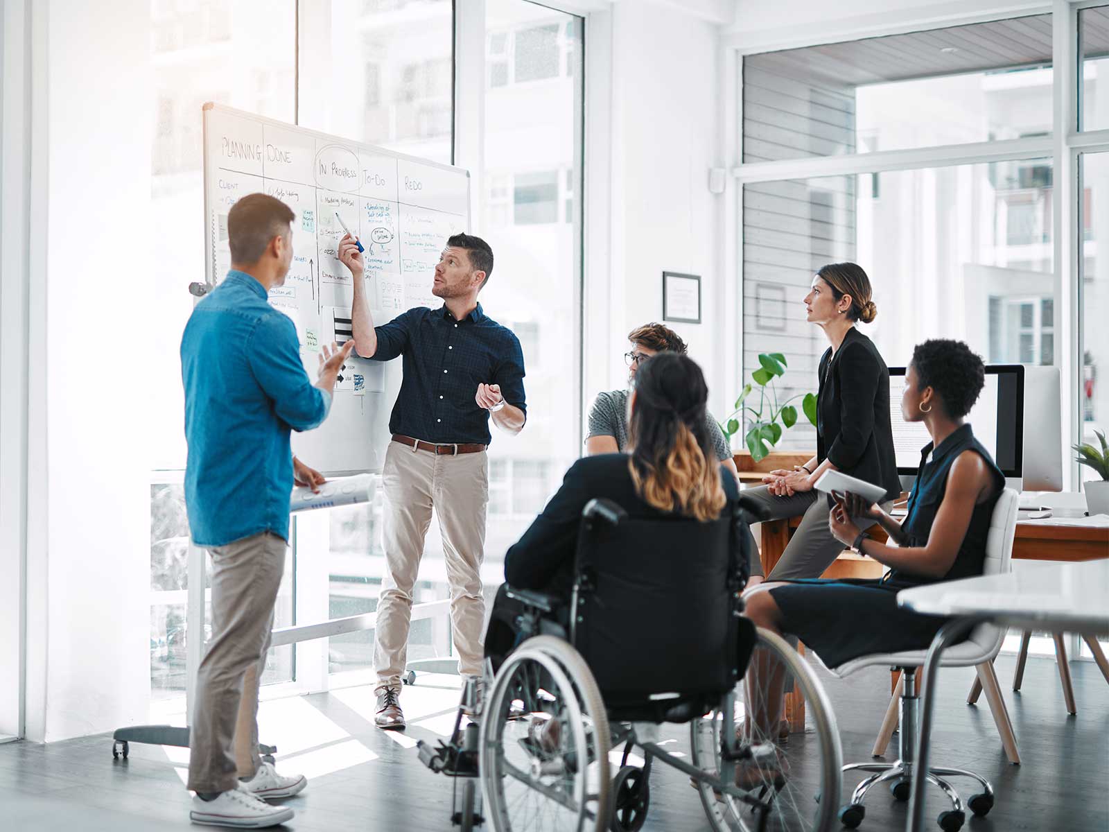 Employees discussing well-being program design