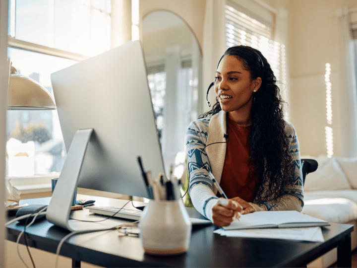 Woman researching on her computer how to improve employee engagement