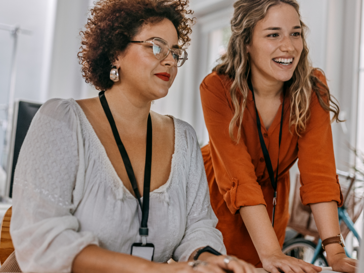 Women completing a workplace wellness assessment