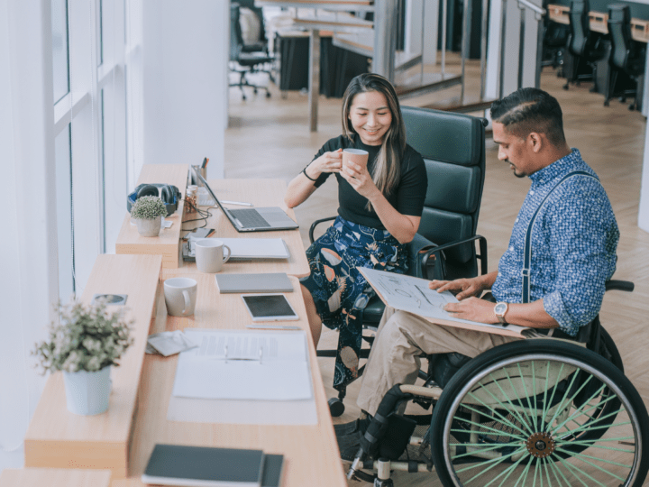 Employees reviewing the ultimate guide to employee engagement solutions